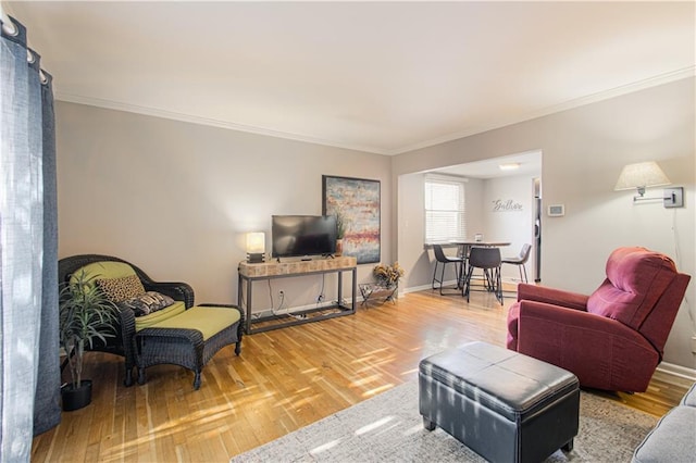 living room featuring crown molding and hardwood / wood-style floors