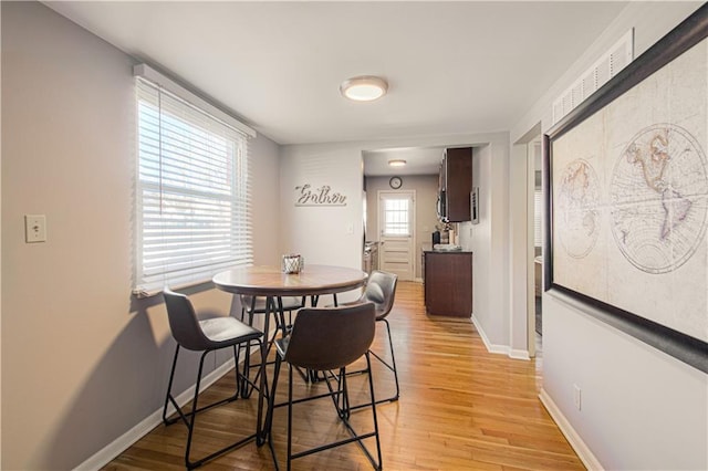 dining room featuring light wood-type flooring