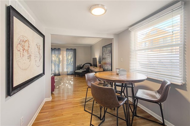 dining space featuring light hardwood / wood-style flooring