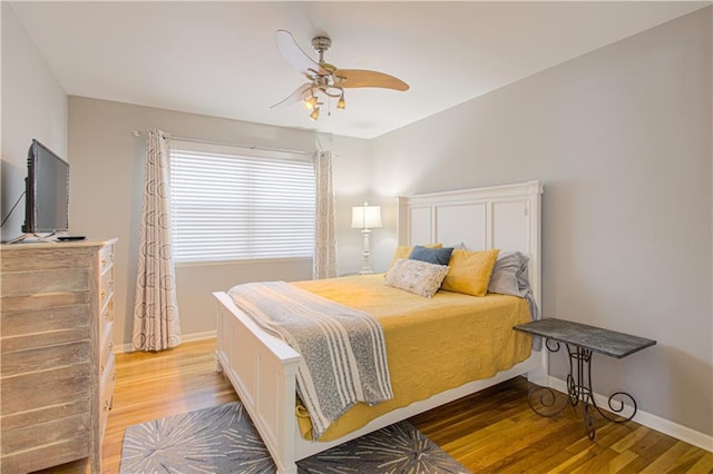 bedroom featuring ceiling fan and wood-type flooring