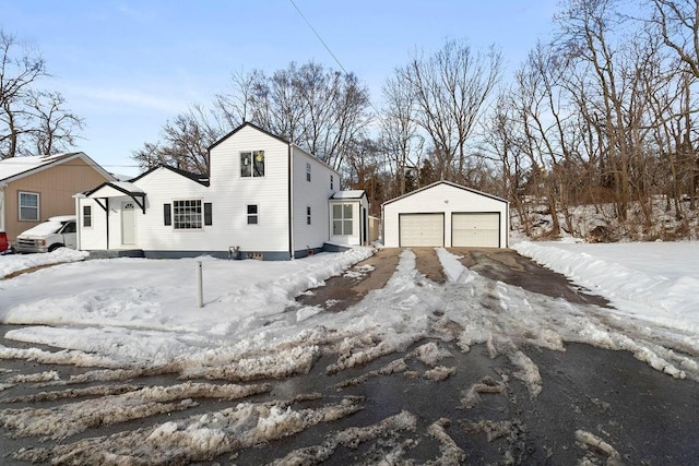 exterior space with a garage and an outdoor structure