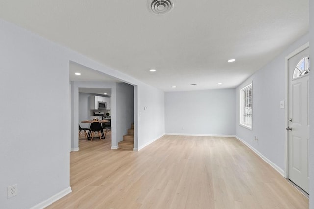 foyer with light wood-type flooring