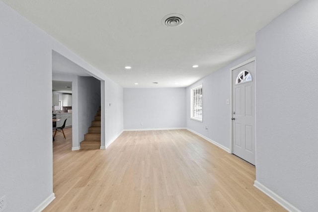 empty room with light hardwood / wood-style floors