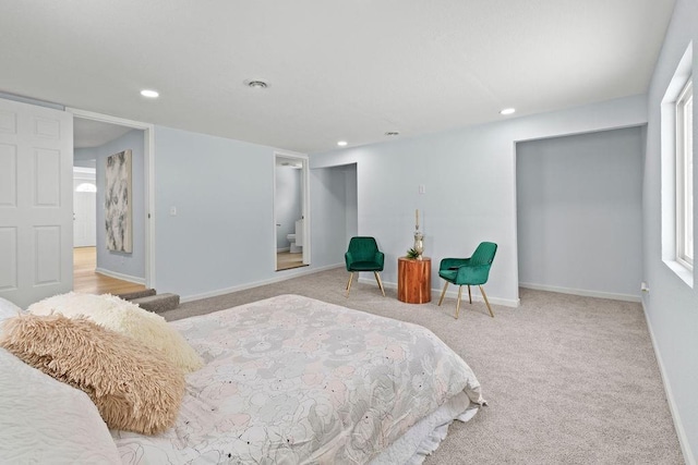 bedroom featuring light carpet