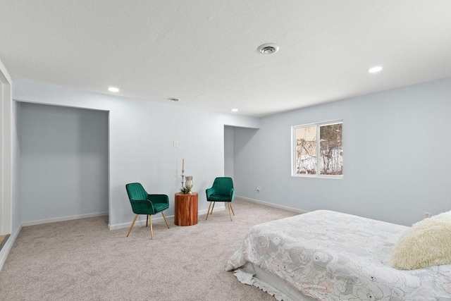 bedroom with light colored carpet