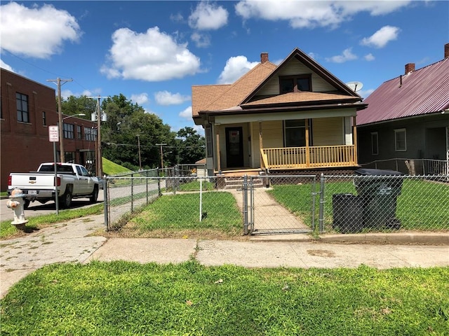 bungalow-style house featuring a porch and a front yard