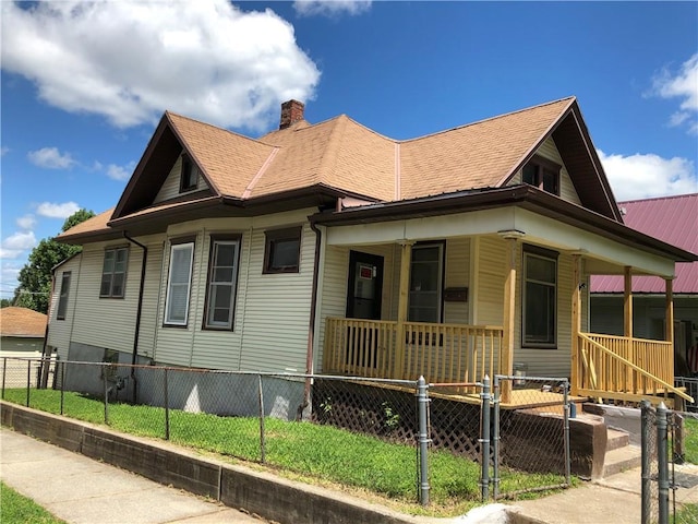 view of side of home with a porch