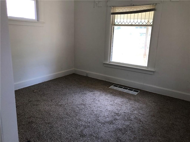 empty room featuring carpet flooring