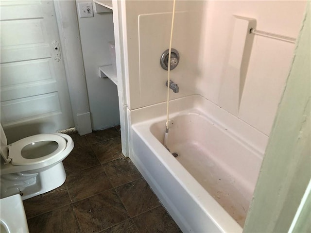 bathroom with toilet and tub / shower combination