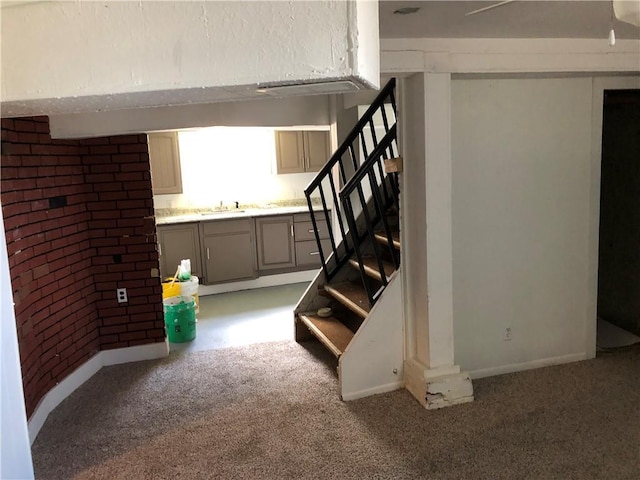 interior space featuring sink and carpet floors