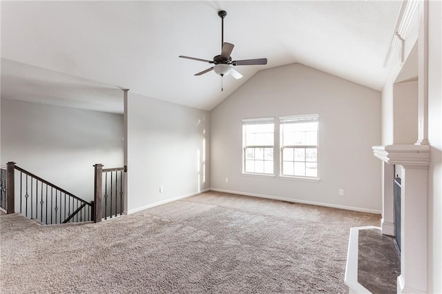 unfurnished living room with ceiling fan, carpet flooring, and vaulted ceiling