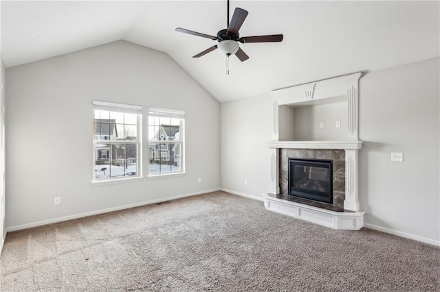 unfurnished living room with ceiling fan, carpet flooring, a tile fireplace, and lofted ceiling