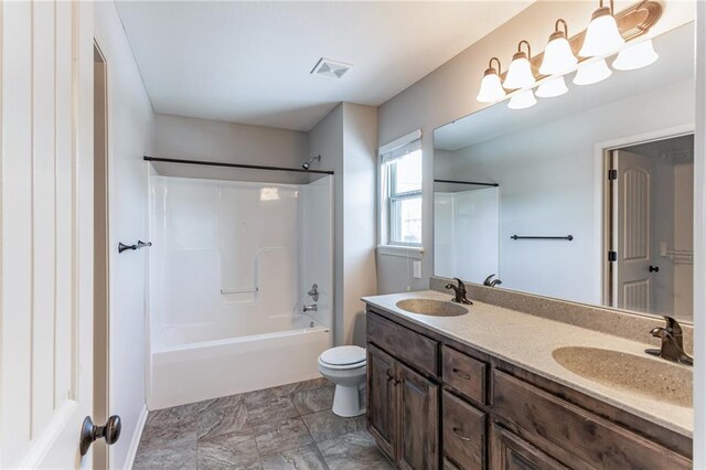 full bathroom featuring toilet, bathing tub / shower combination, and vanity