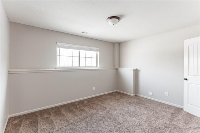 empty room featuring carpet flooring