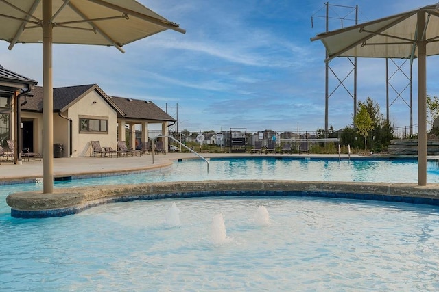 view of pool with pool water feature