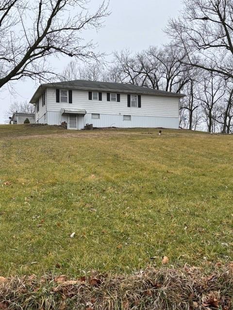 view of front of home with a front lawn