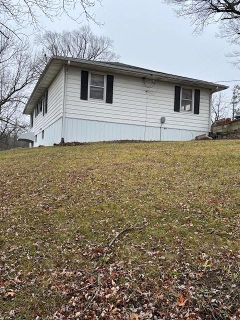 view of property exterior featuring a yard