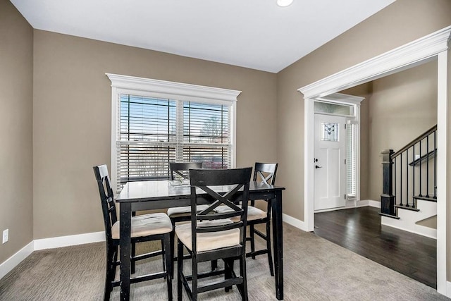 dining space featuring hardwood / wood-style flooring