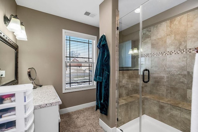 bathroom with vanity and an enclosed shower