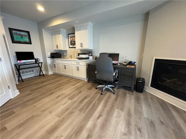 home office with light wood-type flooring