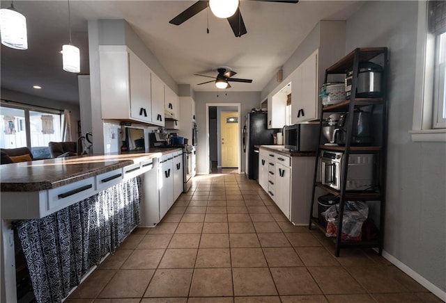 kitchen featuring pendant lighting, white cabinetry, and ceiling fan