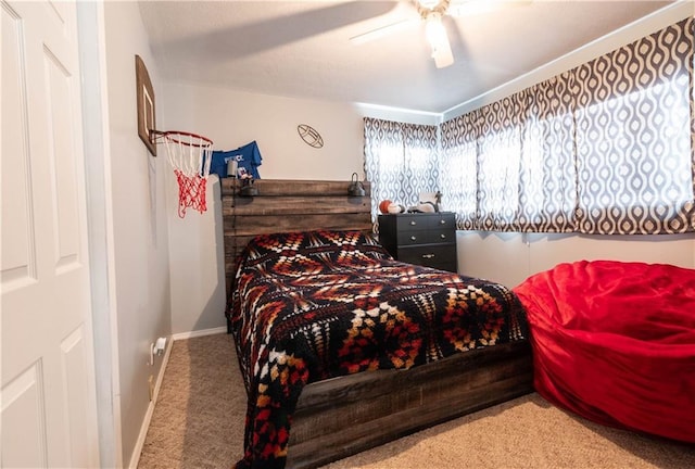 carpeted bedroom featuring ceiling fan