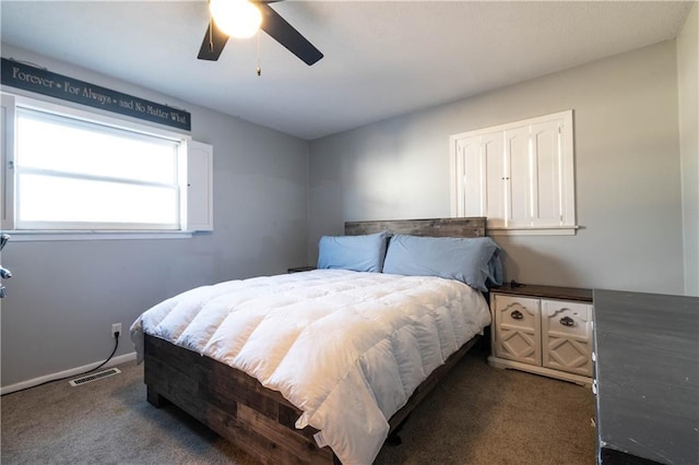 carpeted bedroom with ceiling fan and a closet