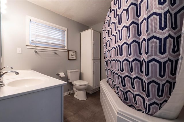 full bathroom with toilet, shower / bathtub combination with curtain, tile patterned floors, and vanity