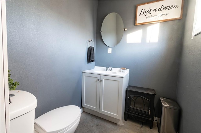 bathroom with toilet and vanity