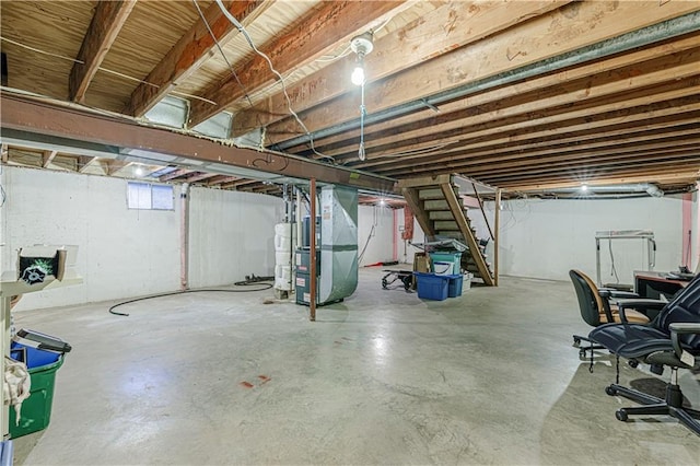 9215 E 85th St, Raytown, MO 64138 - basement with water heater, heating unit, and stairs