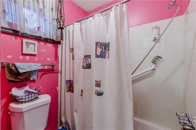 9215 E 85th St, Raytown, MO 64138 - bathroom with shower / tub combo, a textured ceiling, and toilet