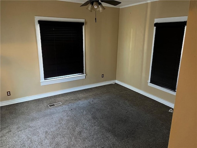 unfurnished room with ceiling fan and carpet floors