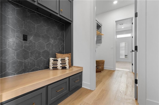 mudroom with light hardwood / wood-style flooring