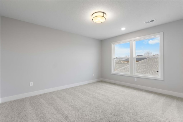 17186 S Heatherwood St, Olathe, KS 66062 - empty room with baseboards, light colored carpet, and recessed lighting