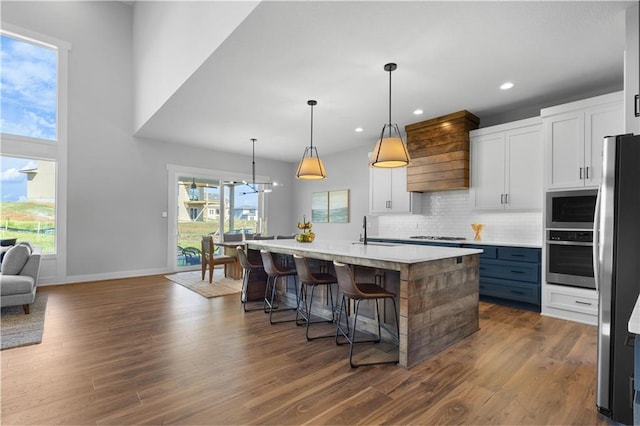 17186 S Heatherwood St, Olathe, KS 66062 - kitchen featuring appliances with stainless steel finishes, a sink, white cabinetry, light countertops, and recessed lighting