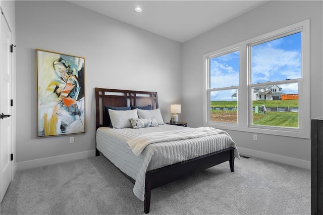 17186 S Heatherwood St, Olathe, KS 66062 - carpeted bedroom featuring baseboards, multiple windows, and recessed lighting