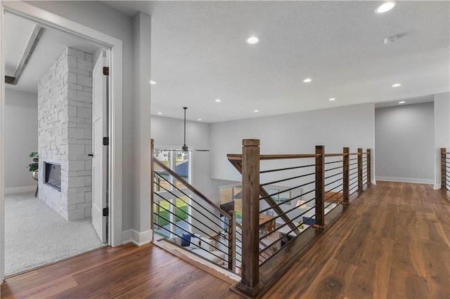 17186 S Heatherwood St, Olathe, KS 66062 - hall featuring an upstairs landing, wood finished floors, baseboards, and recessed lighting