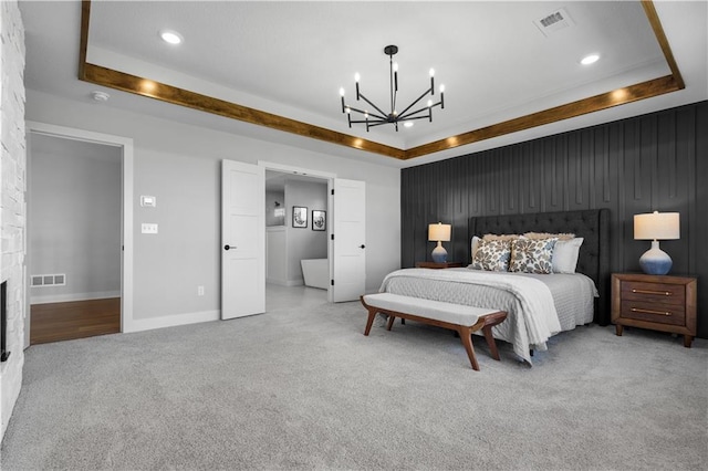 17186 S Heatherwood St, Olathe, KS 66062 - carpeted bedroom featuring a chandelier, a raised ceiling, recessed lighting, a fireplace, and baseboards