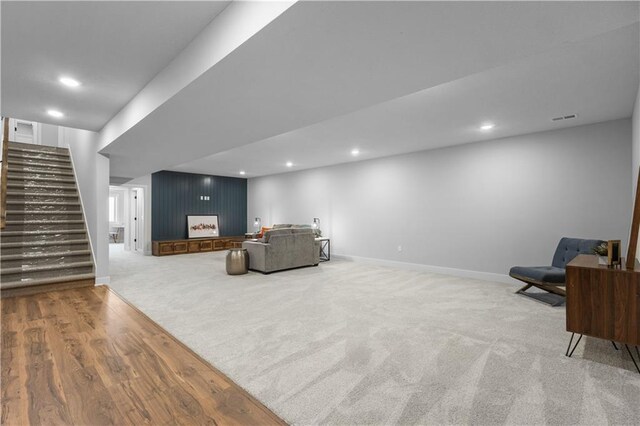 17186 S Heatherwood St, Olathe, KS 66062 - living room with stairway, carpet flooring, recessed lighting, baseboards, and wood finished floors