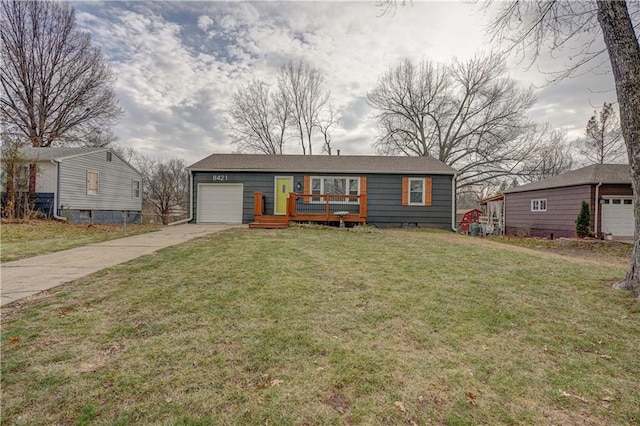 view of front of property with a garage and a front yard