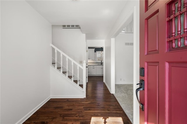 foyer with sink and dark hardwood / wood-style flooring