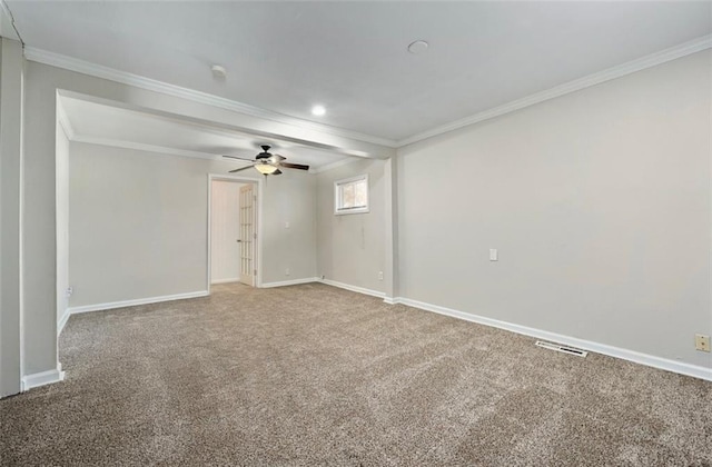 carpeted empty room with ceiling fan and crown molding