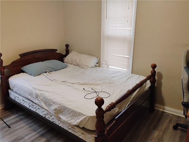 bedroom featuring dark wood-type flooring