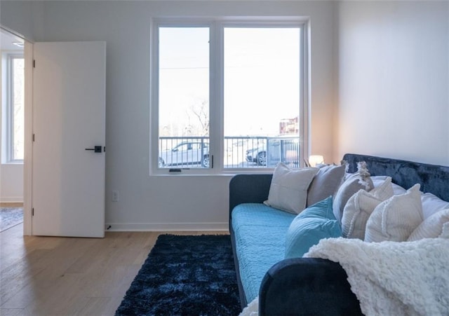 living room with wood finished floors and baseboards