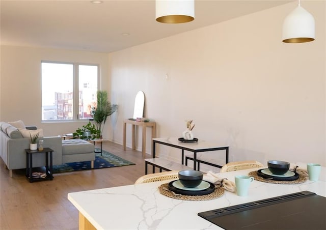 interior space featuring light wood-style flooring and baseboards