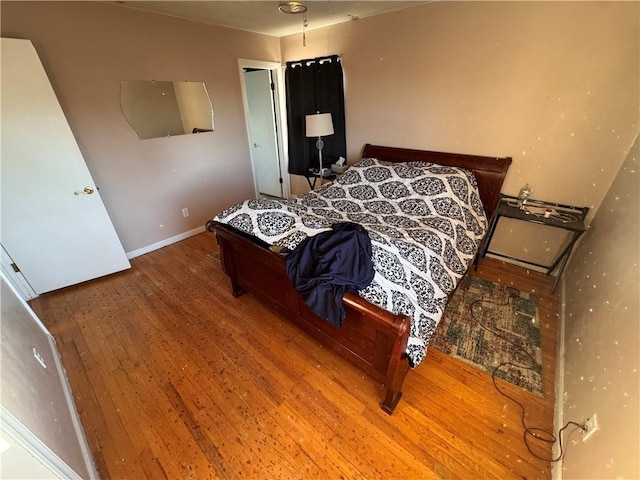 bedroom featuring wood-type flooring