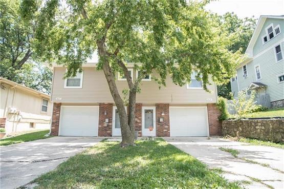 1617 S Claremont Ave, Independence, MO 64052 - view of front of house featuring a garage, brick siding, and driveway