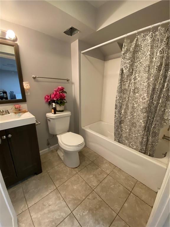 bathroom featuring vanity, baseboards, shower / bath combination with curtain, tile patterned floors, and toilet