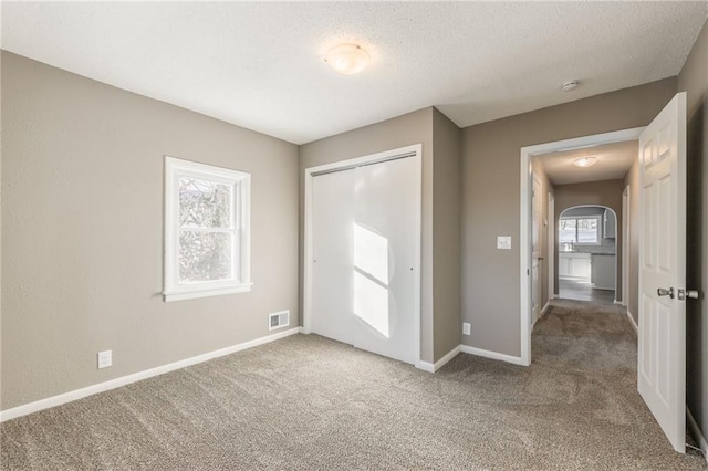 foyer with carpet floors