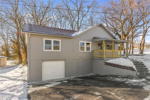 view of front of home with a garage and a porch